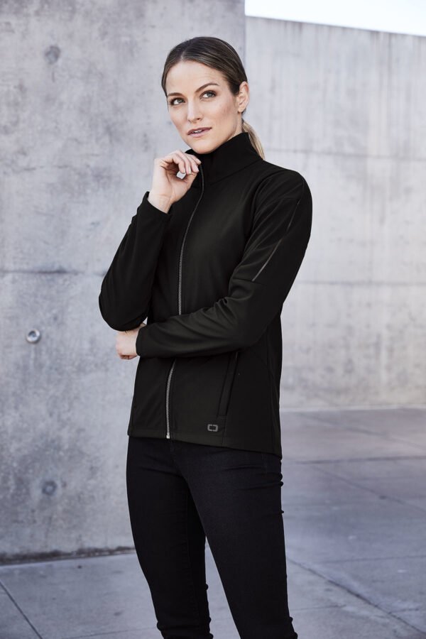 11087-Blacktop-7-LOG755BlacktopModelLifestyle-1200W OGIO® Women's Commuter Full-Zip Soft Shell