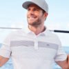 28079-7-TM1MY402WhiteModelLifestyleSP23-1200W TravisMathew Coastal Chest Stripe Polo